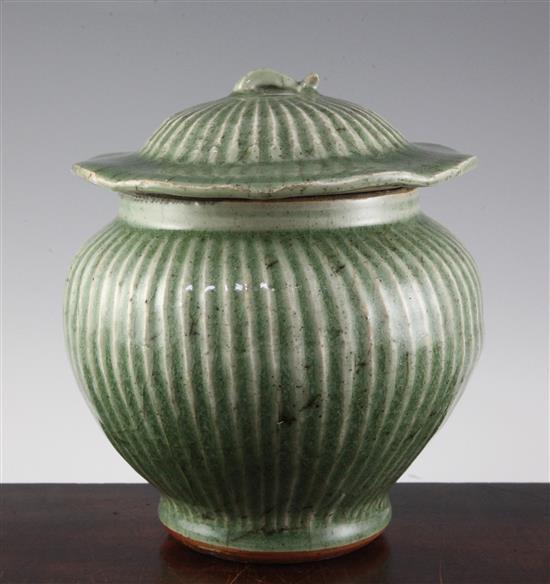 A Chinese Longquan celadon hundred rib jar and cover, Guan, Ming dynasty, 15th/16th century height 21cm, crazing to glaze